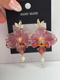 Pendientes Dorados con Flor Real Orquídea Morada | JOYERÍA BOTÁNICA |