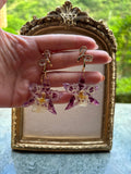 Pendientes Dorados con Flor Real Orquídea Morada | JOYERÍA BOTÁNICA |